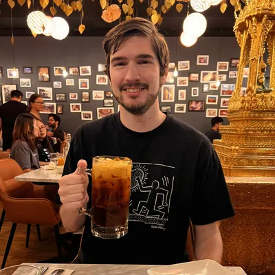 A picture of myself enjoying some Thai iced tea.