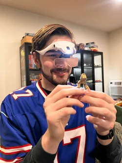 A bird sitting on a nest of eggs.